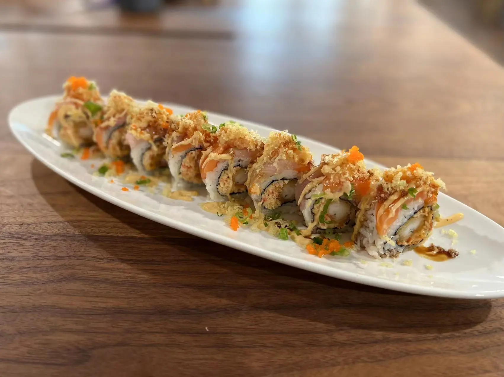 Okini-Sushi-Japanese-Restaurant-Honey-Bunny-Roll-Pleasant-Hill Shrimp tempura, spicy crabmeat topped w.salmon, hamachi, crawfish salad at Okini Sushi, a Japanese Restaurant in Pleasant Hill
